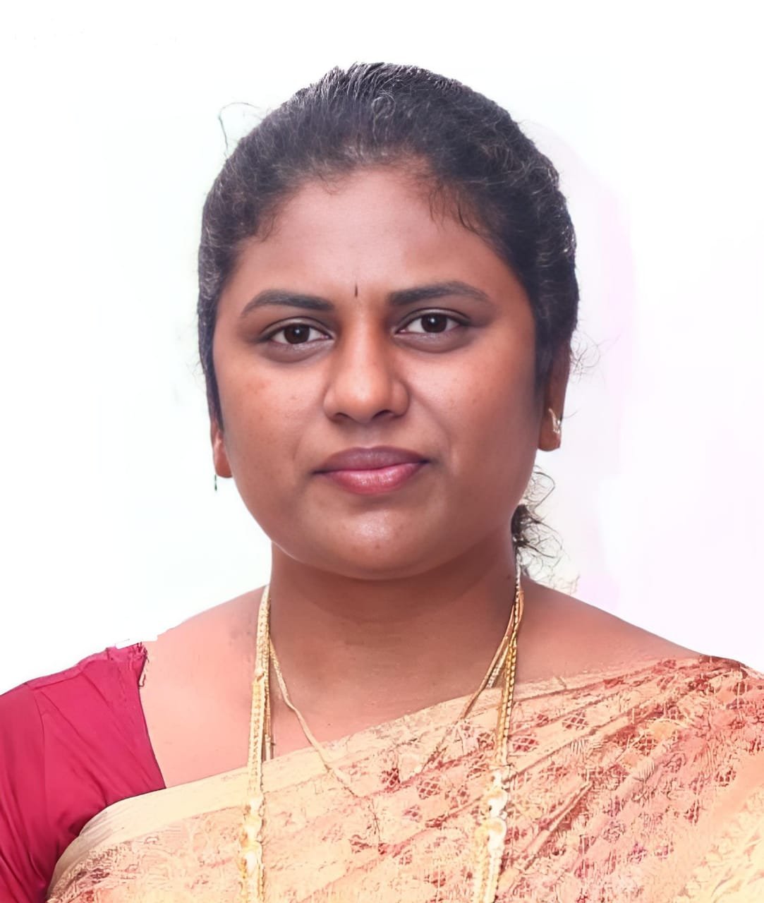 Portrait of Dr. M. Helena Selvakodi in a professional clinical setting